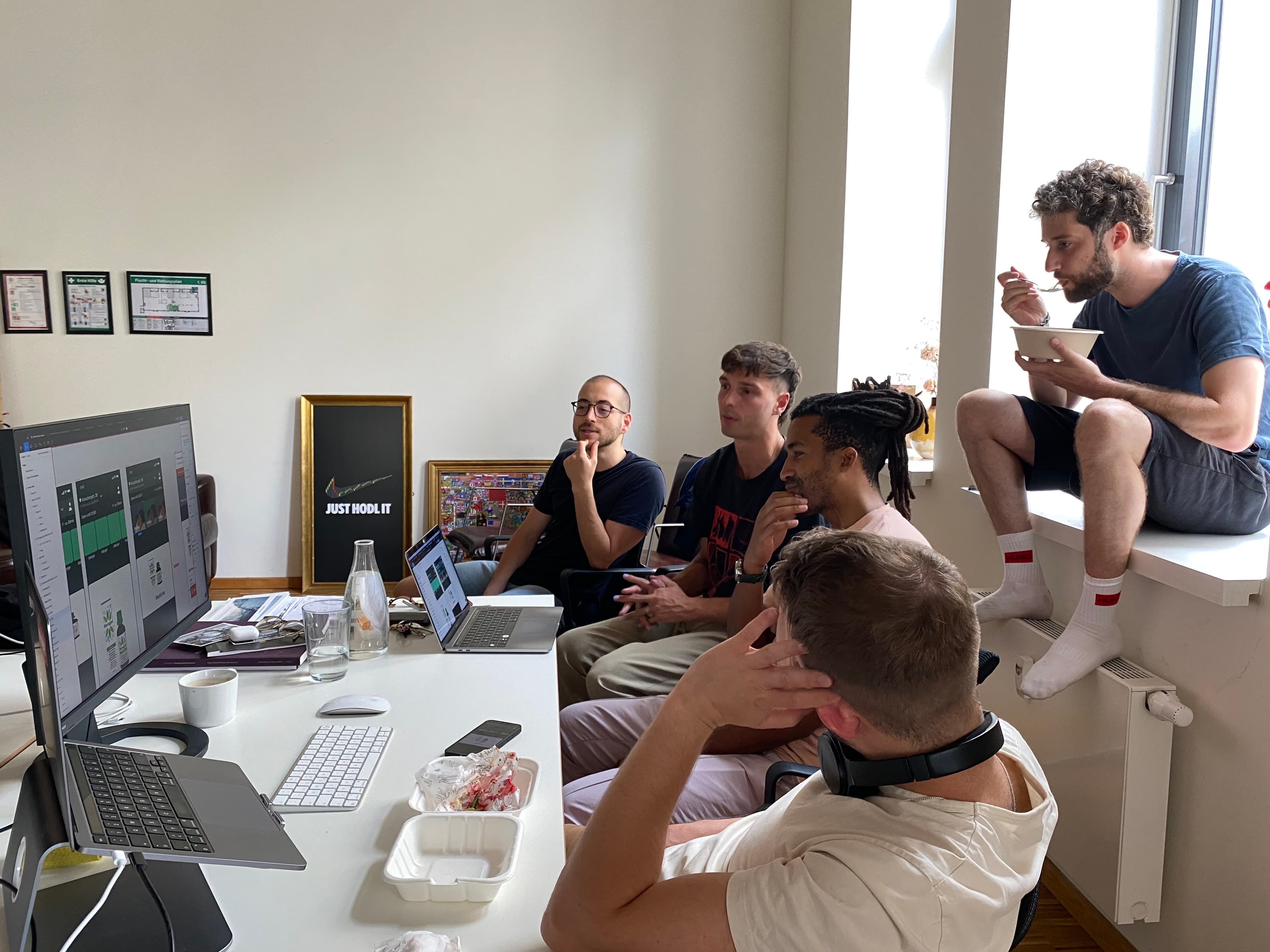 The team discussing some design options in the office